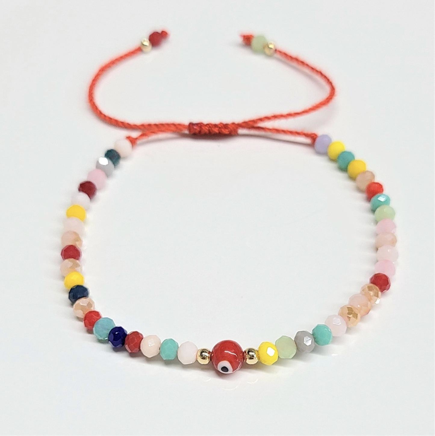 Pulsera protectora - Ojo turco con cuentas facetadas de hilo rojo