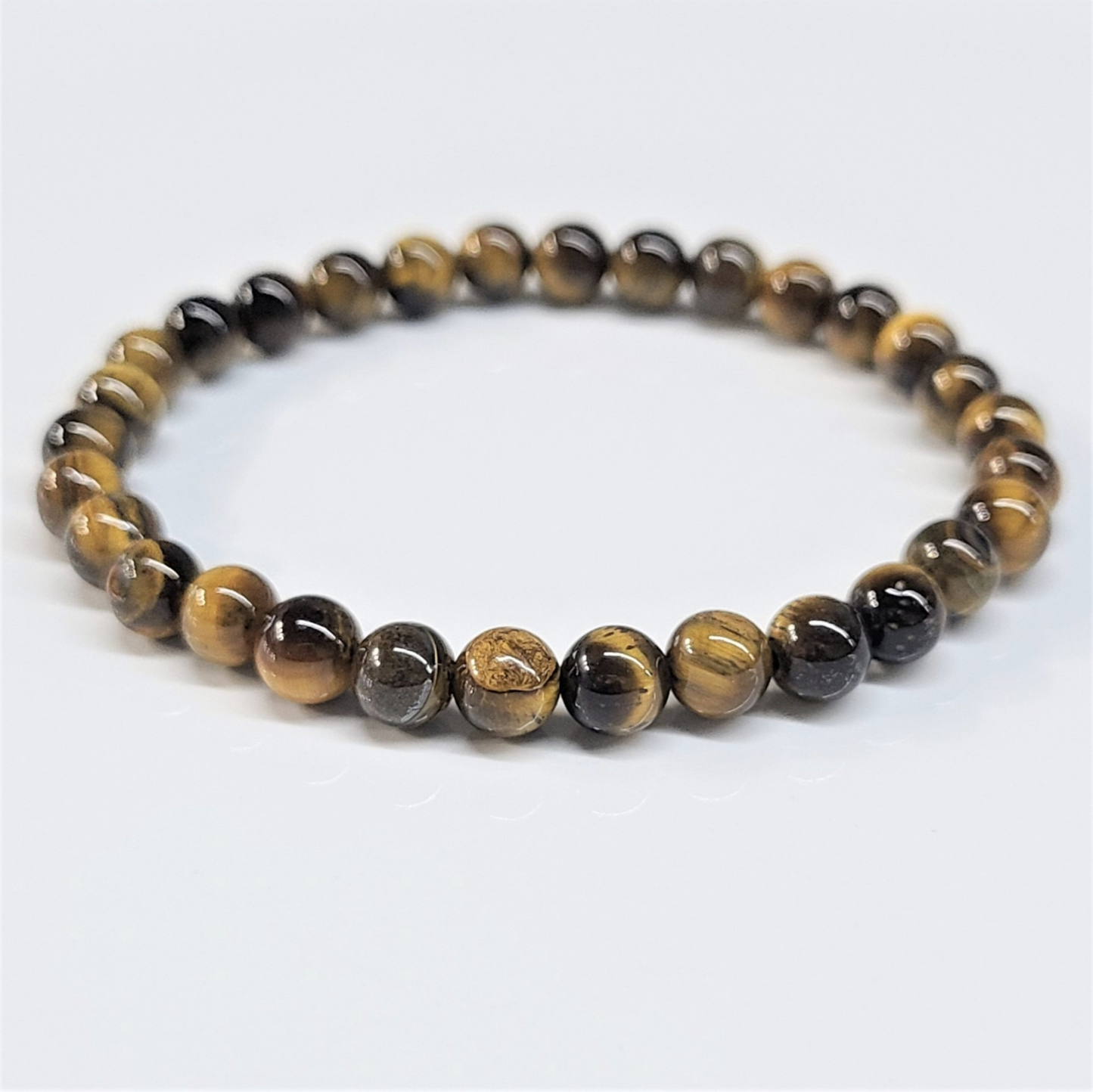 Pulsera de Cuentas Redondas de Ojo de Tigre - Confianza Arraigada